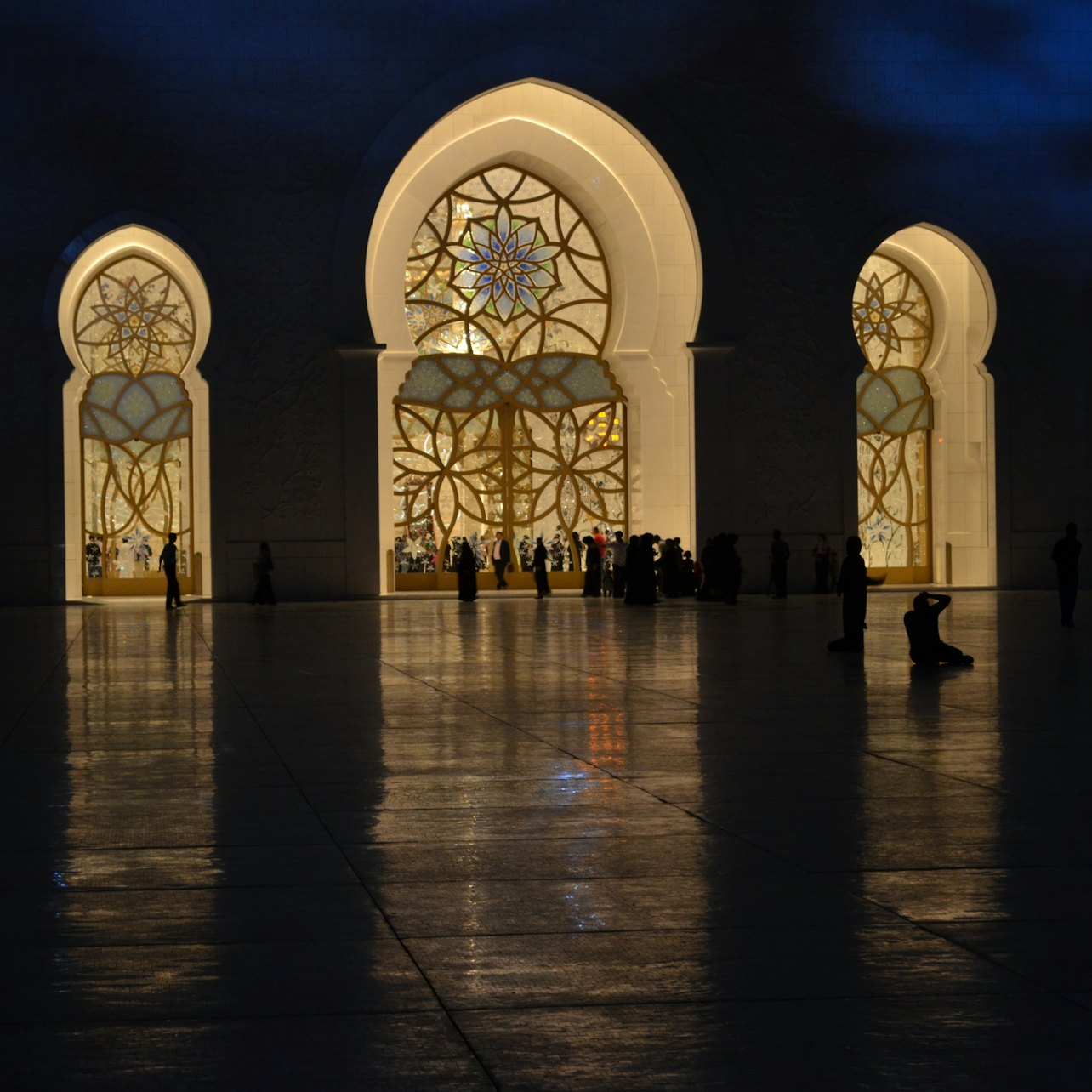 Experience the stunning beauty of Abu Dhabi's architectural wonders including intricate designs and illuminated facades perfectly showcased during your guided city tour from Dubai. Explore the cultural gems with every step.